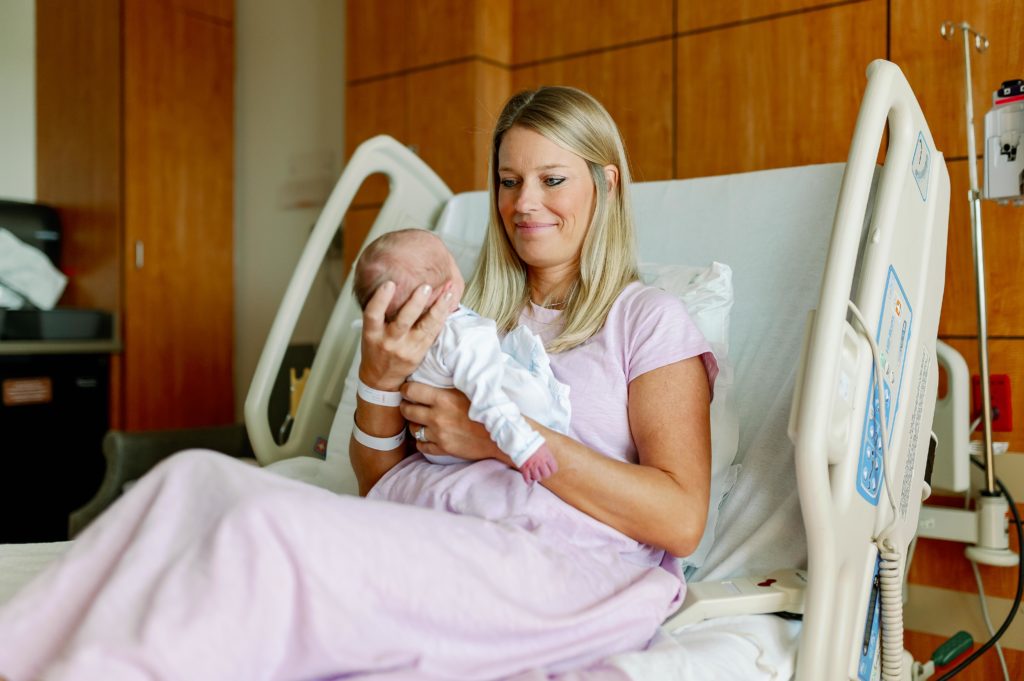 mom admiring newborn in fort worth hospital