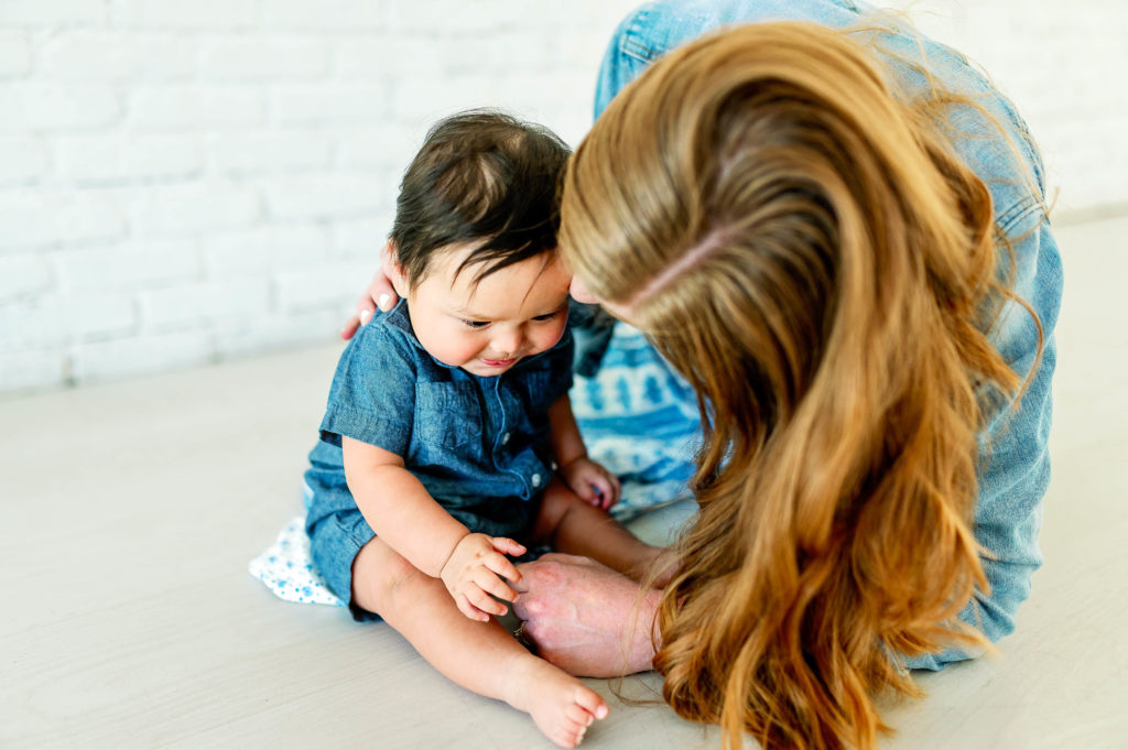 mom playing with baby during motherhood session