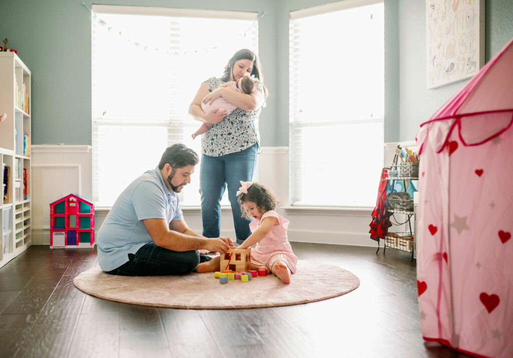 family playing with blocks during photography session