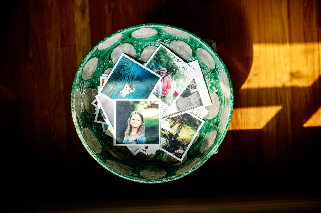 family prints displayed in decorative bowl

