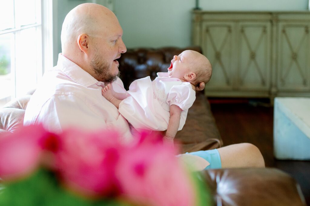 dad holding newborn baby