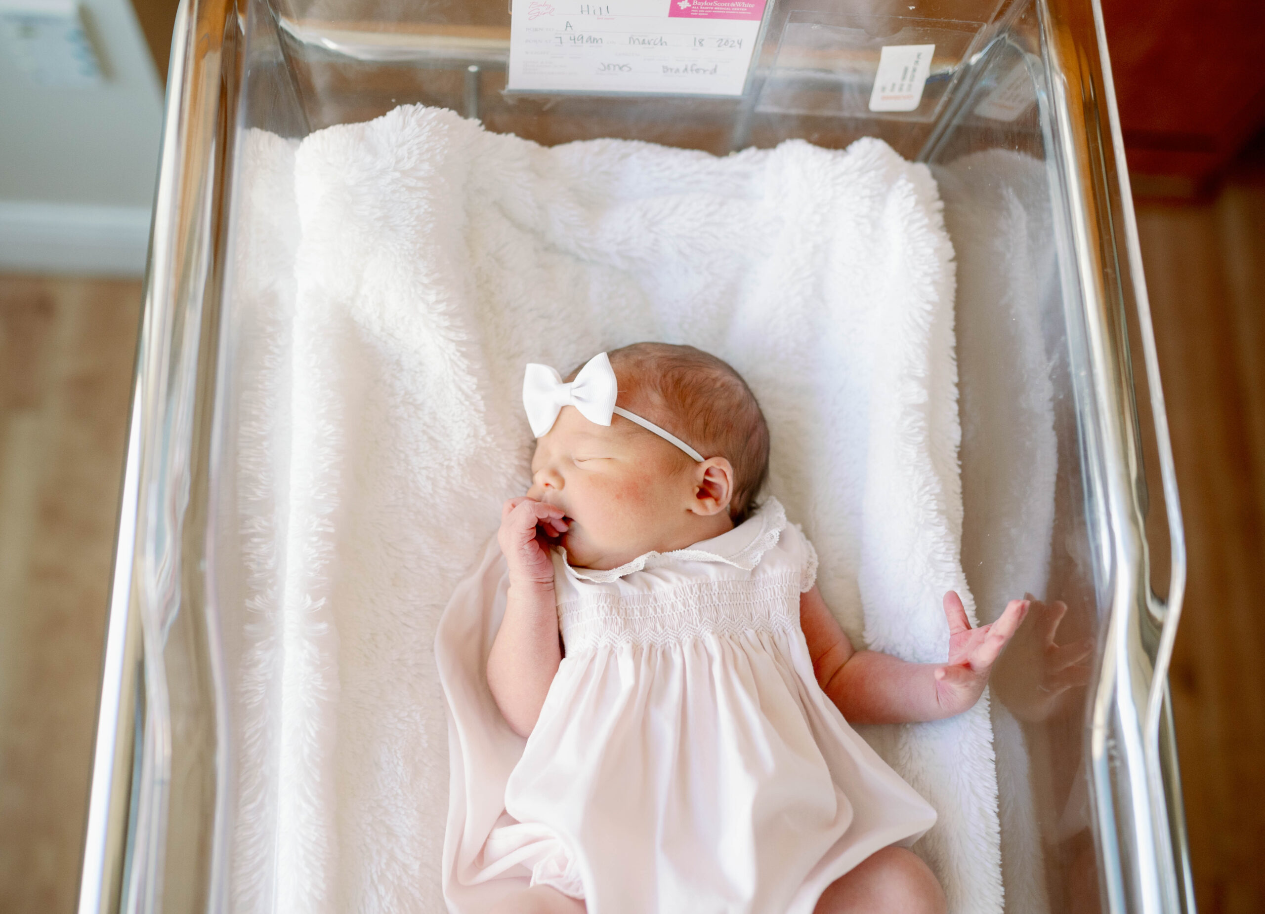newborn in bassinet