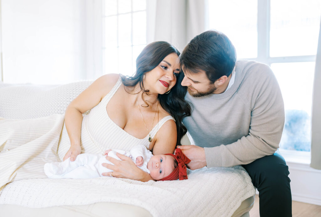 parents with newborn during newborn in-home session