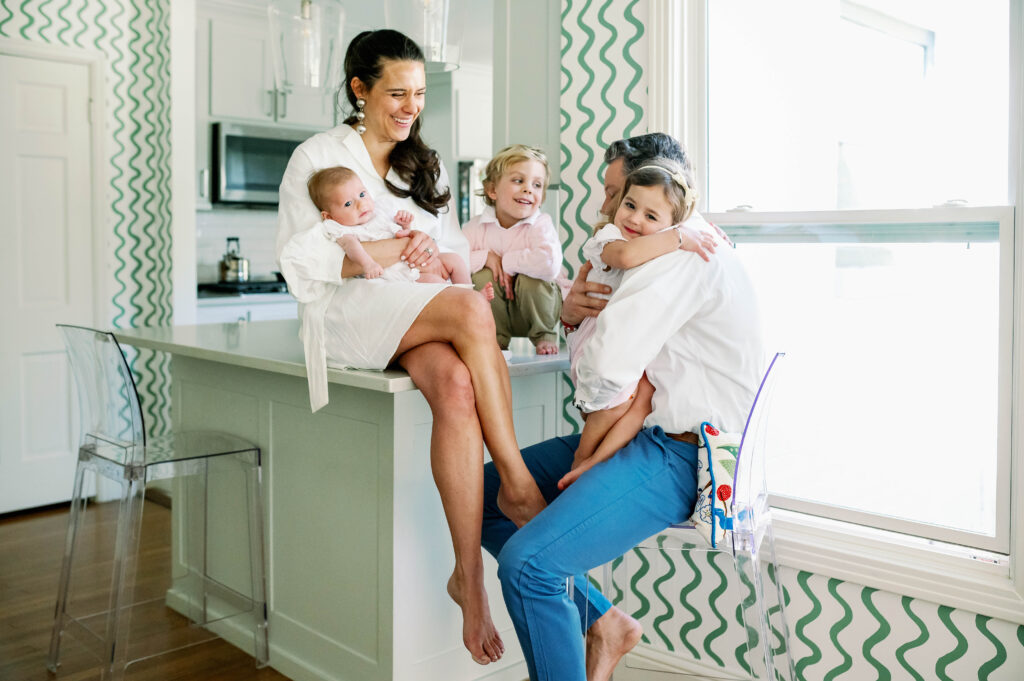 family in coordinating outfits for family newborn pictures
