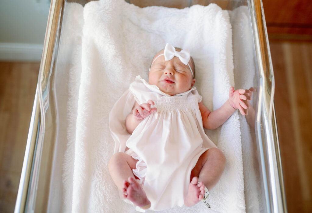 Newborn baby girl at the hospital for a Fresh 48 Session with Allison Krogess.
