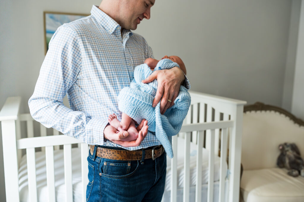 Close-up detail shot of newborn baby's feet, an example of newborn photography poses.