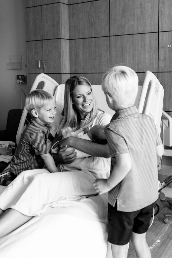 siblings meeting newborn in hospital 