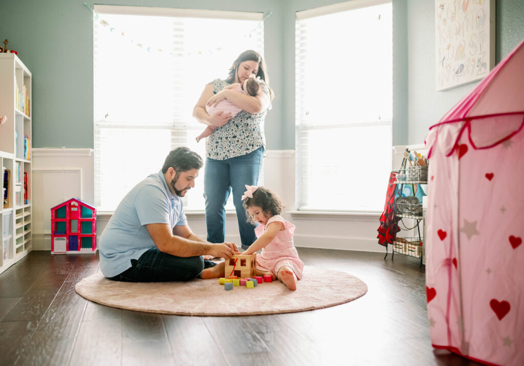 family playing with blocks during photography session
