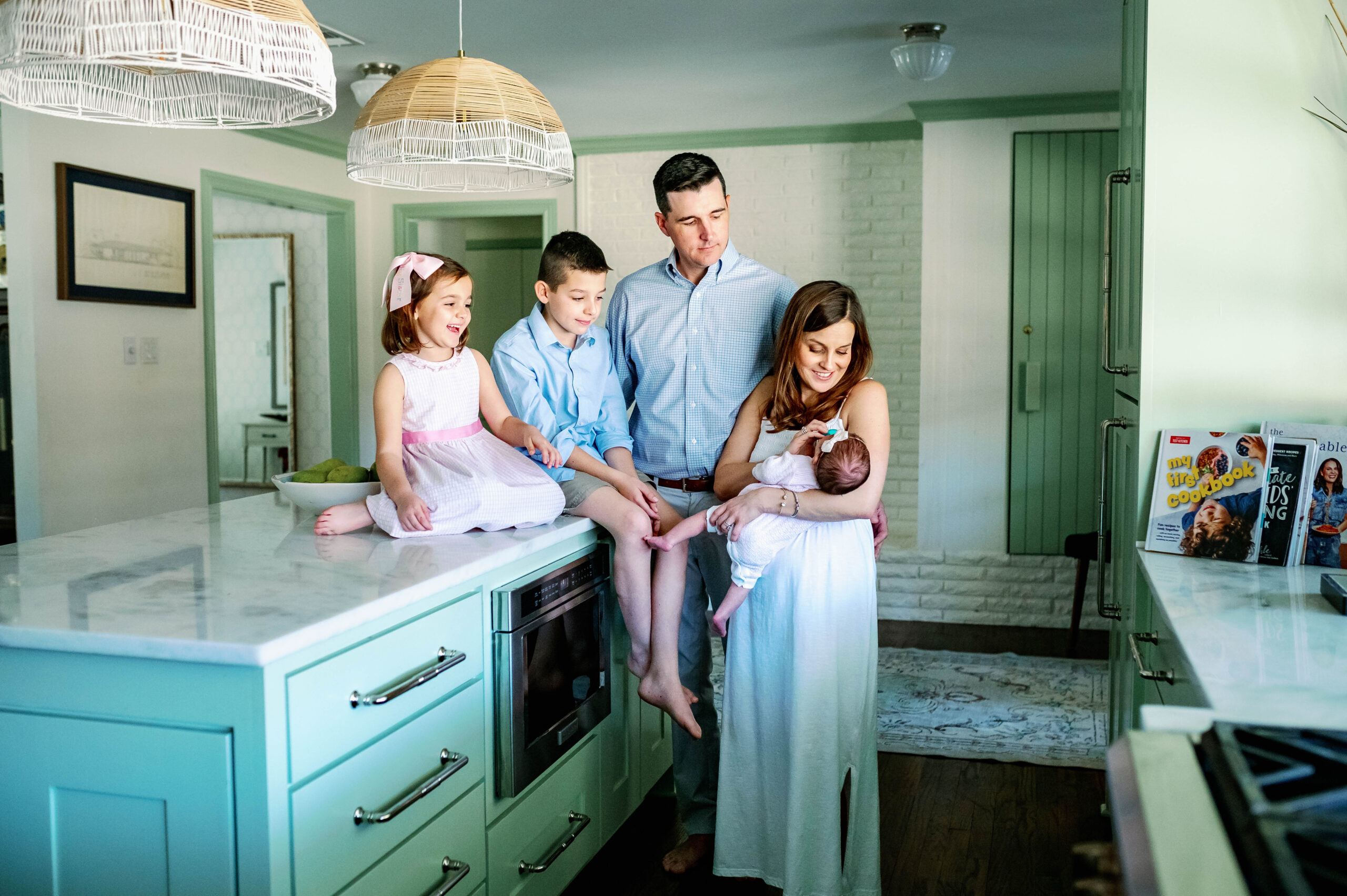 young fort worth family in kitchen eenjoying their newborn