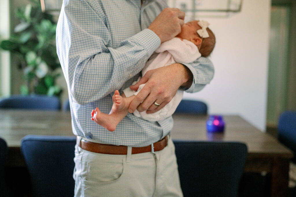 dad holding baby 