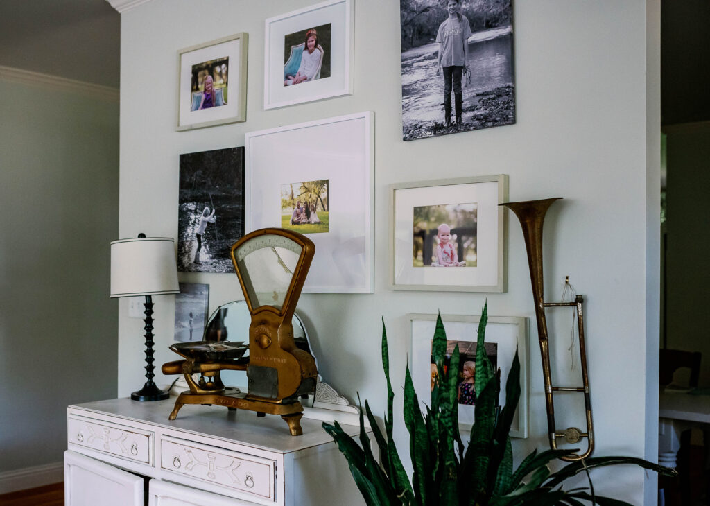 gallery wall of family photographs

