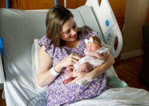 Mother holding newborn for Fresh 48 Session