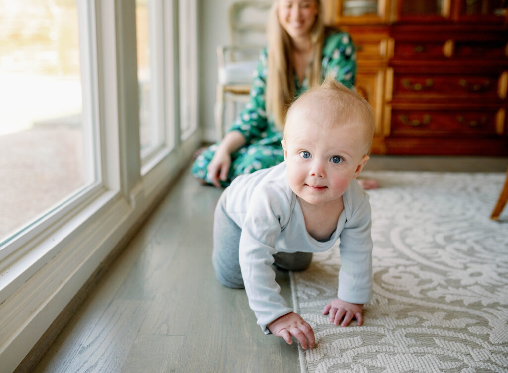 baby crawling during milestone photo session