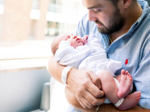 dad holding newborn