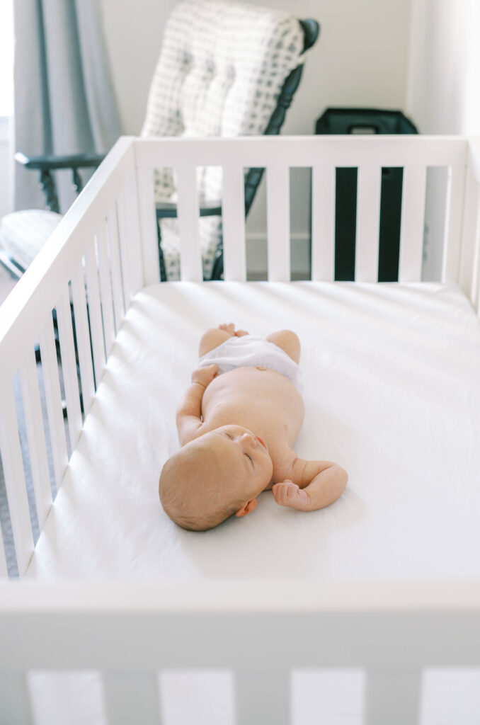 newborn in crib
